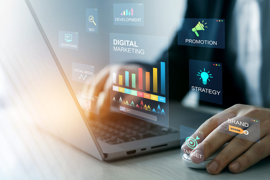 person on laptop with digital strategy icons hovering over it